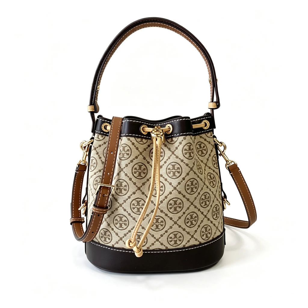 Tory Burch T Monogram | Off-white base with hazelnut brown monogram jacquard pattern and dark brown leather trim  drawstring closure versatile handbag suitable for commuting and travel