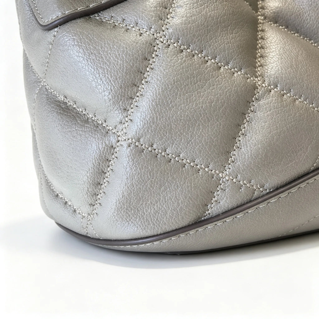 Tory Burch Willa | Grey-brown lambskin leatheradorned with a gold double-T logo detachable chain shoulder strap  drawstring closure  women's designer handbag