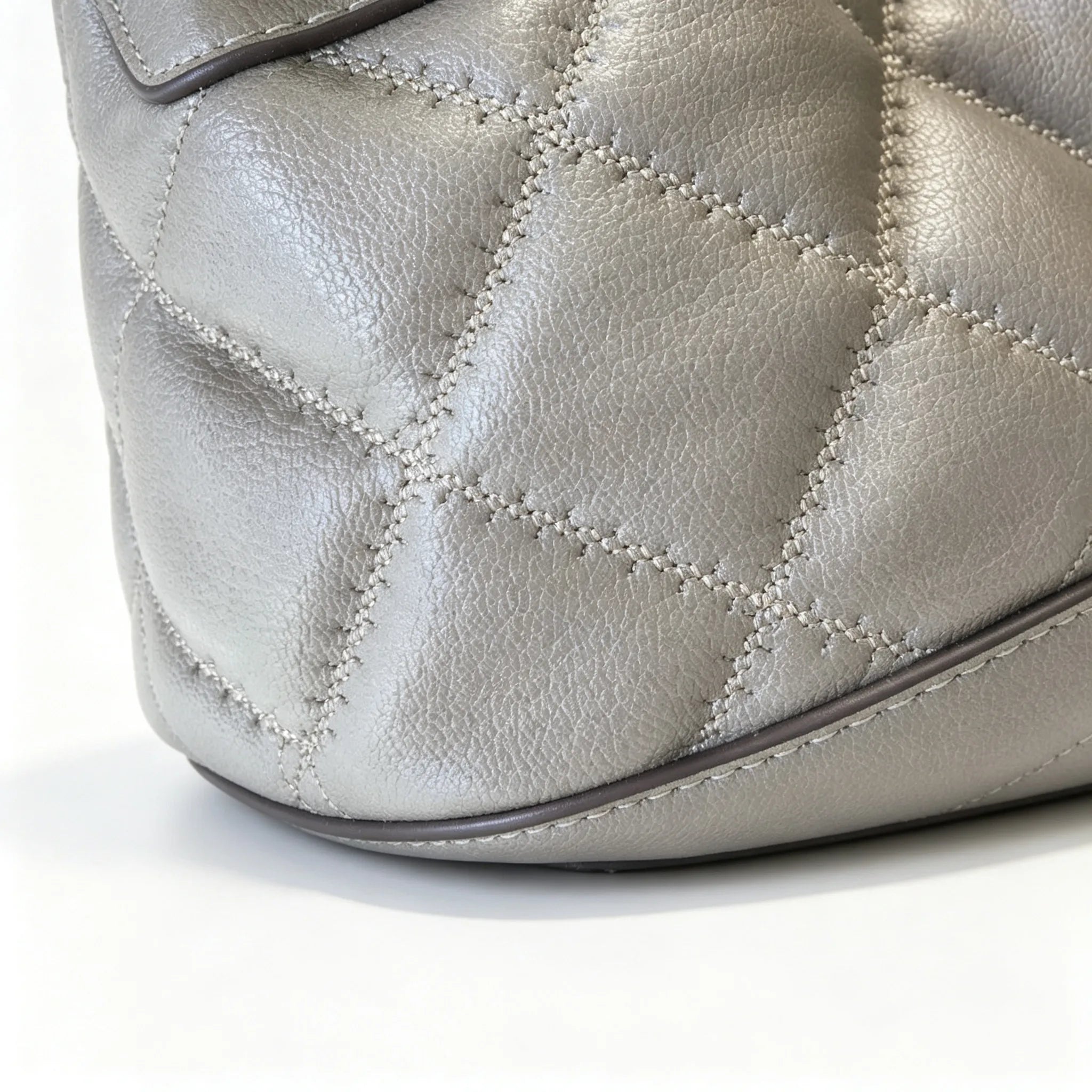 Tory Burch Willa | Grey-brown lambskin leatheradorned with a gold double-T logo detachable chain shoulder strap  drawstring closure  women's designer handbag