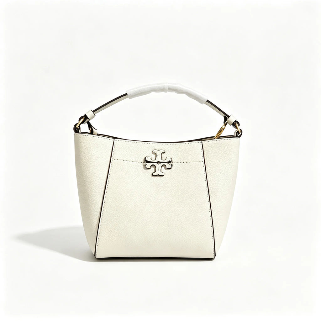 Tory Burch McGraw | Off-white pebbled leather with an adjustable shoulder strap and top handle  offering multiple carrying options  A women's designer handbag  perfect for work and weekend getaways