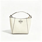Tory Burch McGraw | Off-white pebbled leather with an adjustable shoulder strap and top handle  offering multiple carrying options  A women's designer handbag  perfect for work and weekend getaways