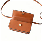 Tory Burch Eleanor | Caramel brown Nappa leather  adjustable shoulder strap  multiple carrying options  women's designer handbag