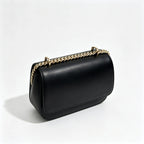 Tory Burch Eleanor | Black leather adjustable chain shoulder strap multiple carrying options women's designer handbag