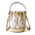Tory Burch T Monogram ivory and beige Monogram canvas adorned with gold heart studs drawstring closure and detachable shoulder strap women's designer handbag