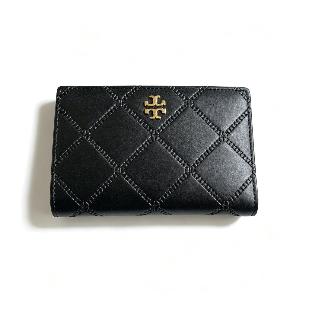 Tory Burch Fleming black quilted leather clutch with multiple card slots and a zippered coin pocket