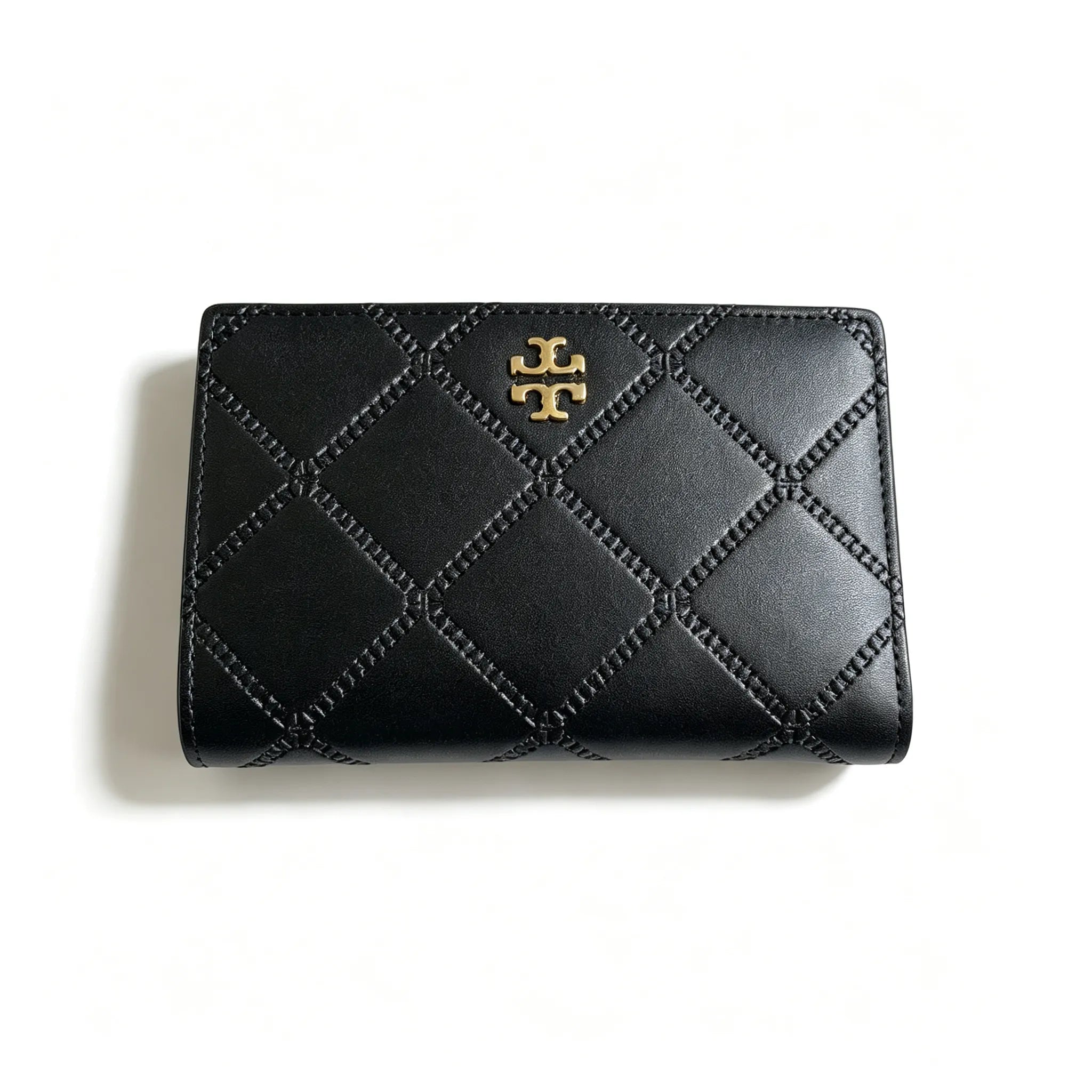 Tory Burch Fleming black quilted leather clutch with multiple card slots and a zippered coin pocket