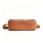 Tory Burch Britten caramel brown adjustable shoulder strap and zippered lining a small everyday bag for women