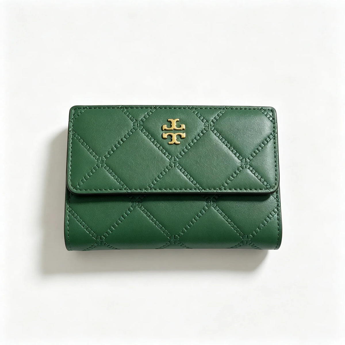 Tory Burch Fleming black quilted leather clutch with multiple card slots and a zippered coin pocket