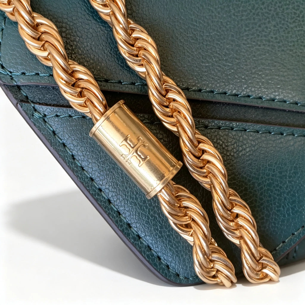 Tory Burch Eleanor in deep sea green with a gold double-T adjustable twist chain shoulder strap offering multiple carrying options for women