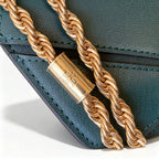 Tory Burch Eleanor in deep sea green with a gold double-T adjustable twist chain shoulder strap offering multiple carrying options for women