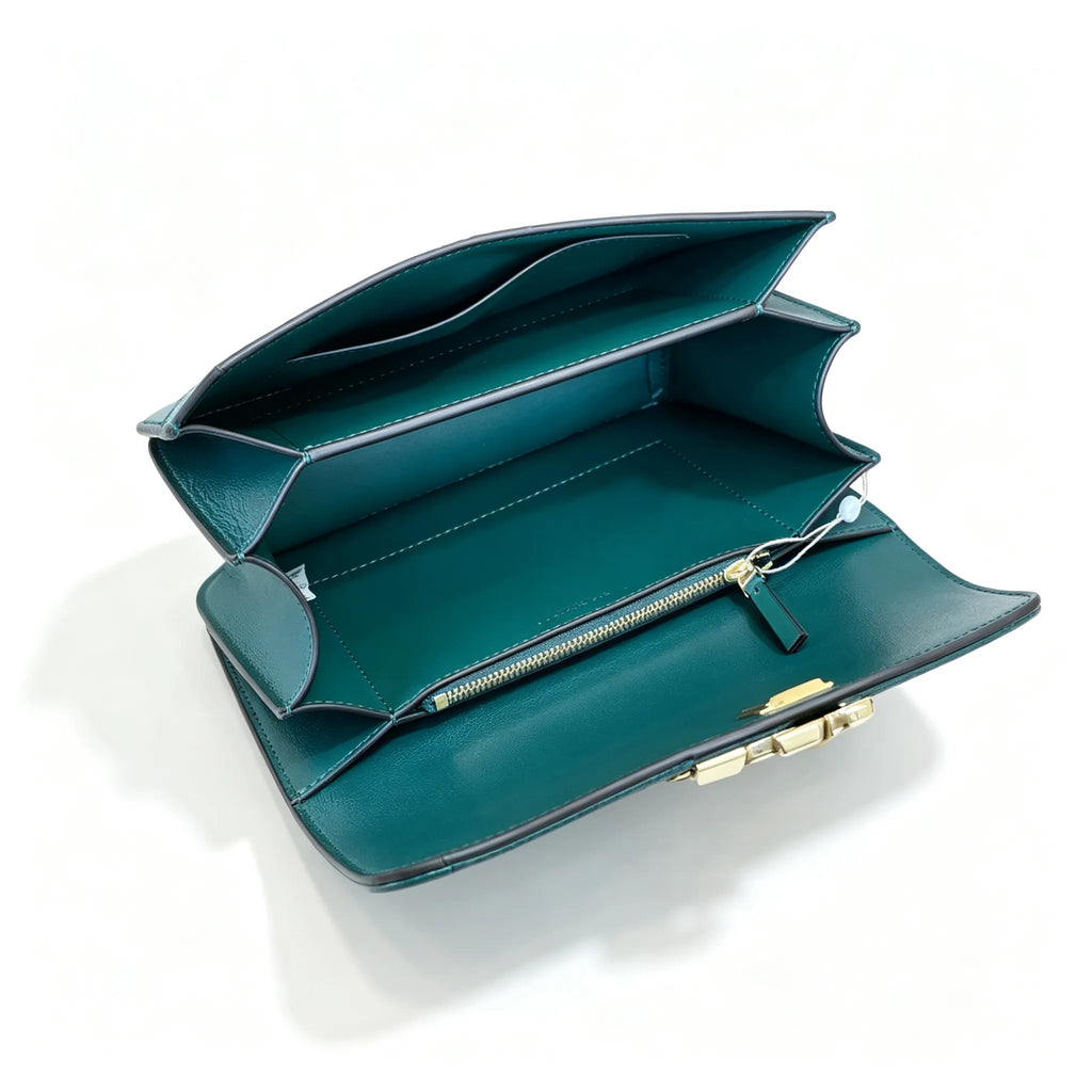 Tory Burch Eleanor in deep sea green with a gold double-T adjustable twist chain shoulder strap offering multiple carrying options for women