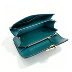 Tory Burch Eleanor in deep sea green with a gold double-T adjustable twist chain shoulder strap offering multiple carrying options for women