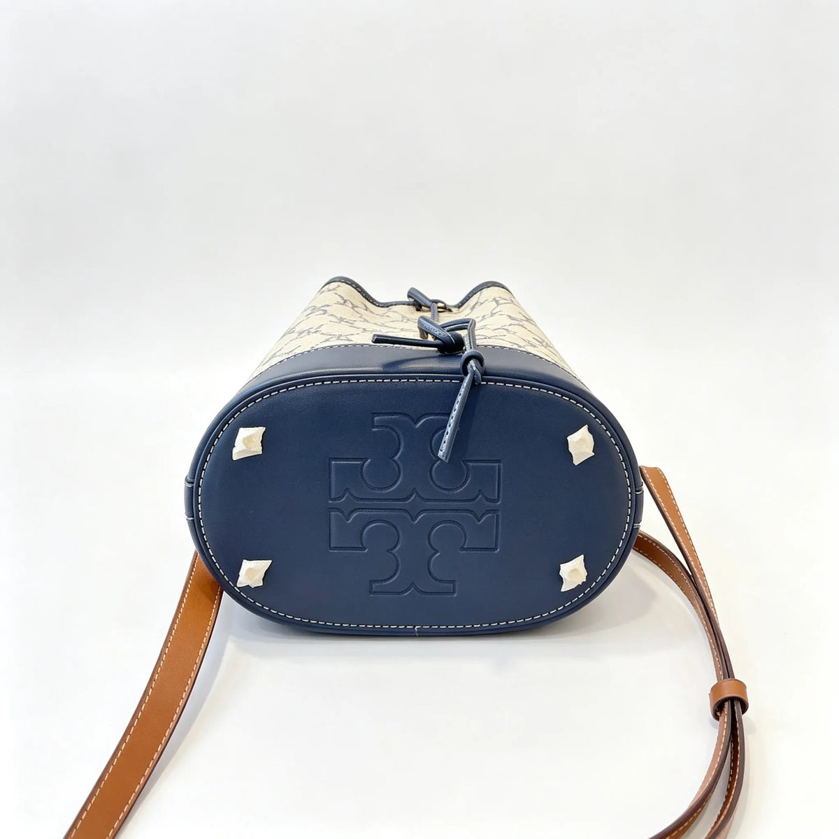 Tory Burch T Monogram | Navy blue and beige Monogram fabric leather trim  adjustable shoulder strap drawstring closure  women's designer mini jacquard bucket bag