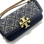 Tory Burch navy and beige Monogram canvas with an adjustable leather shoulder strap convertible into a crossbody or shoulder bag women's style