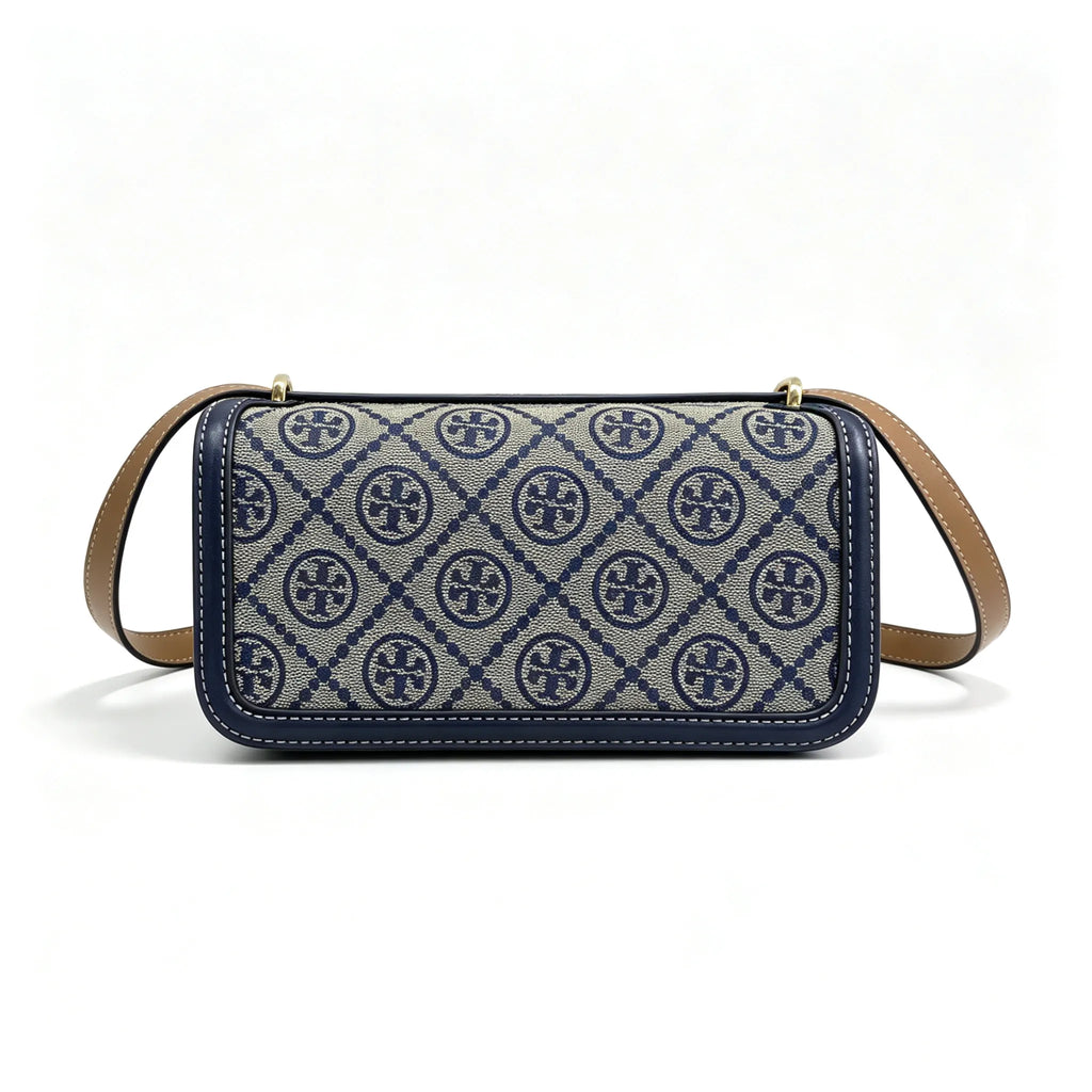 Tory Burch navy and beige Monogram canvas with an adjustable leather shoulder strap convertible into a crossbody or shoulder bag women's style
