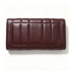 Tory Burch Kira burgundy quilted Nappa leather clutch with multiple card slots and a zippered coin purse