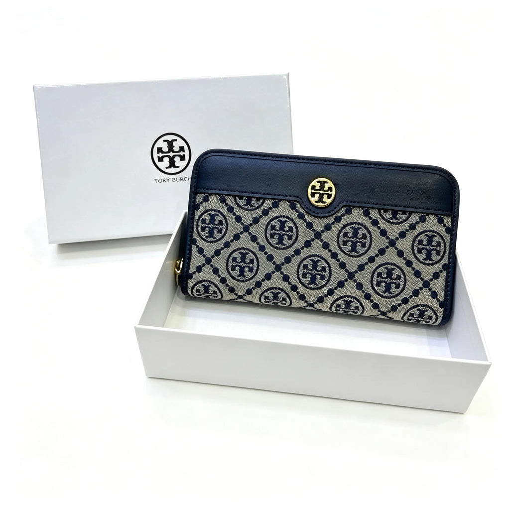 Tory Burch T Monogram wallet in navy and beige Monogram canvas, long with multiple card slots and a zipper