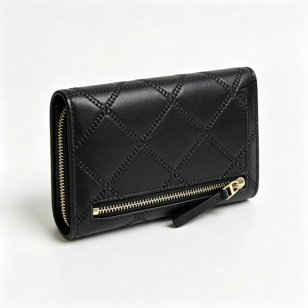 Tory Burch Fleming black quilted leather clutch with multiple card slots and a zippered coin pocket