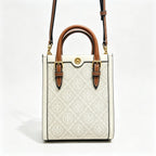 Tory Burch T Monogram | Off-white embossed canvas with brown leather trim detachable shoulder strap  women's designer mini handbag