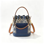 Tory Burch T Monogram | Navy blue and beige Monogram fabric leather trim  adjustable shoulder strap drawstring closure  women's designer mini jacquard bucket bag
