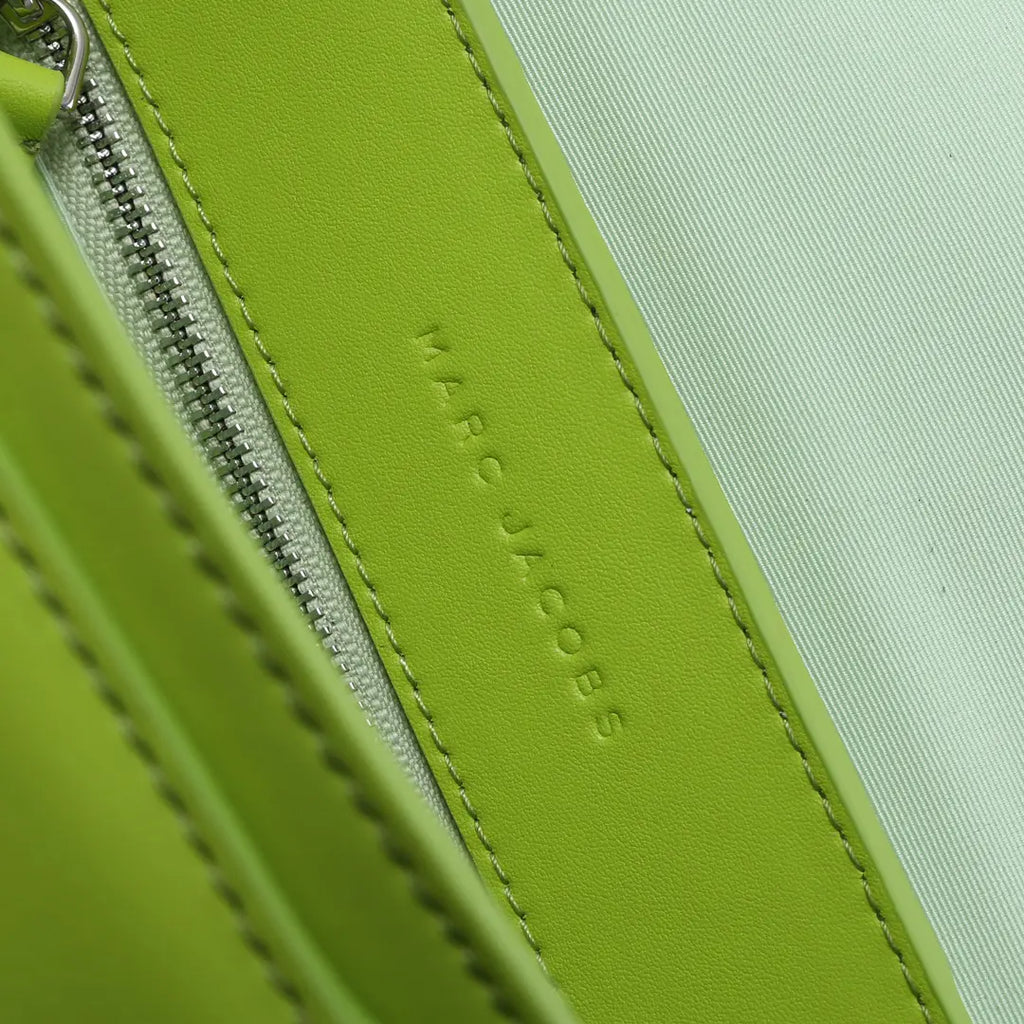 Marc Jacobs J Marc Saddle Bag, bright green smooth leather crossbody bag with brand logo shoulder strap.
