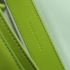 Marc Jacobs J Marc Saddle Bag, bright green smooth leather crossbody bag with brand logo shoulder strap.