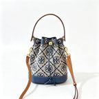 Tory Burch T Monogram | Navy blue and beige Monogram fabric leather trim  adjustable shoulder strap drawstring closure  women's designer mini jacquard bucket bag
