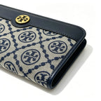 Tory Burch T Monogram wallet in navy and beige Monogram canvas, long with multiple card slots and a zipper