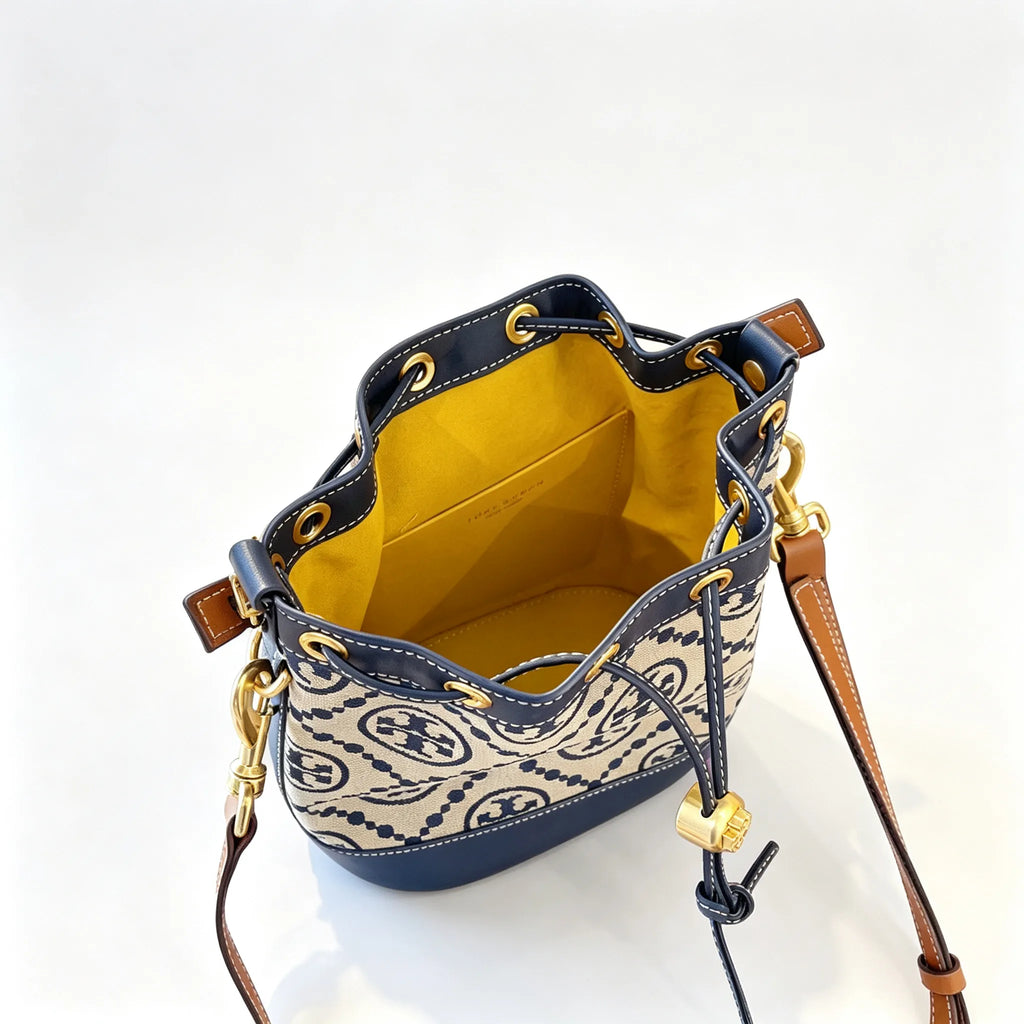 Tory Burch T Monogram | Navy blue and beige Monogram fabric leather trim  adjustable shoulder strap drawstring closure  women's designer mini jacquard bucket bag