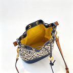Tory Burch T Monogram | Navy blue and beige Monogram fabric leather trim  adjustable shoulder strap drawstring closure  women's designer mini jacquard bucket bag