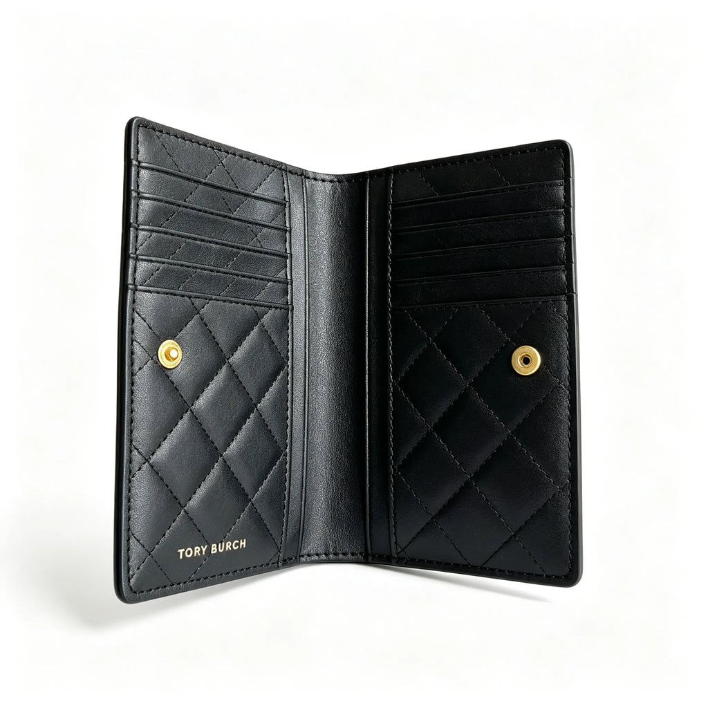Tory Burch Fleming black quilted leather clutch with multiple card slots and a zippered coin pocket
