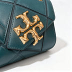 Tory Burch Eleanor in deep sea green with a gold double-T adjustable twist chain shoulder strap offering multiple carrying options for women
