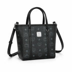 MCM Mini Toni Visetos Handbag, black, women’s handbag, featuring a detachable crossbody strap and the classic monogram print.