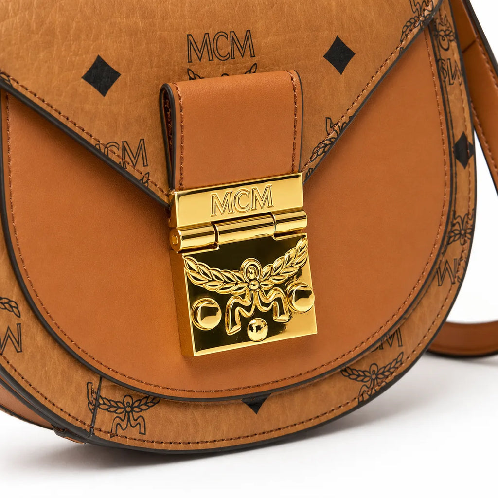 MCM Cognac Visetos Saddle Bag – Brown Monogram Crossbody Purse with Gold-Tone Buckle
