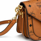MCM Cognac Visetos Saddle Bag – Brown Monogram Crossbody Purse with Gold-Tone Buckle
