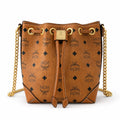 MCM Soft Berlin Visetos Mini Bucket Bag Cognac | Gold Chain Shoulder Bag for Women — Designer Coated Canvas Drawstring Crossbody