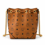 MCM Soft Berlin Visetos Mini Bucket Bag Cognac | Gold Chain Shoulder Bag for Women — Designer Coated Canvas Drawstring Crossbody