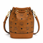 MCM Dessau Visetos Bucket Bag Mini | Drawstring Crossbody Shoulder Bag in Cognac — Designer Coated Canvas & Leather Handbag