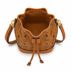 MCM Dessau Visetos Bucket Bag Mini | Drawstring Crossbody Shoulder Bag in Cognac — Designer Coated Canvas & Leather Handbag