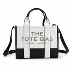 Marc Jacobs The Tote Bag Small Black & White Colorblock Pebble Leather Top-Handle Crossbody Bag with Embossed Logo