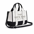 Marc Jacobs The Tote Bag Small Black & White Colorblock Pebble Leather Top-Handle Crossbody Bag with Embossed Logo