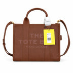 Marc Jacobs | Brown pebbled leather embossed logo  detachable shoulder strap  women's commuter handbag