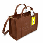 Marc Jacobs | Brown pebbled leather embossed logo  detachable shoulder strap  women's commuter handbag