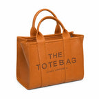 Marc Jacobs | Brown pebbled leather embossed logo detachable shoulder strap women's commuter handbag