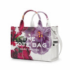 Marc Jacobs Medium Future Floral | White base with vibrant floral print  embossed logo detachable shoulder strap  women's commuter tote bag