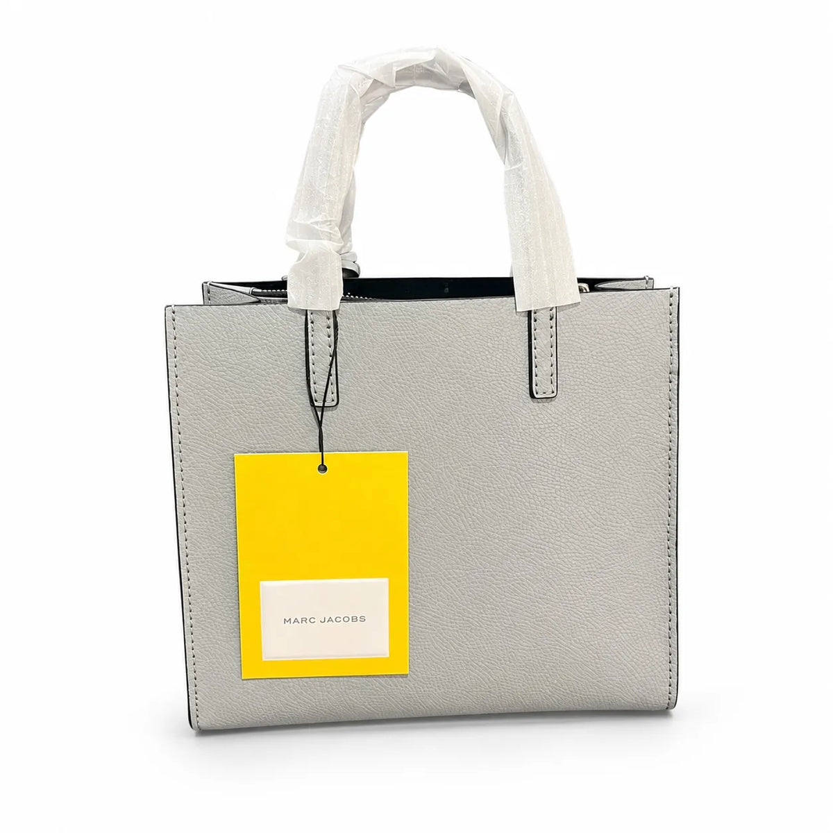 Marc Jacobs The Mini Grind | Light grey pebbled leather  embossed logo  detachable shoulder strap  women's commuter handbag