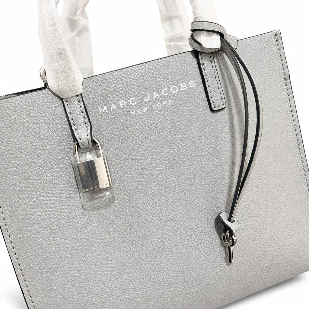 Marc Jacobs The Mini Grind | Light grey pebbled leather  embossed logo  detachable shoulder strap  women's commuter handbag