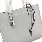 Marc Jacobs The Mini Grind | Light grey pebbled leather  embossed logo  detachable shoulder strap  women's commuter handbag