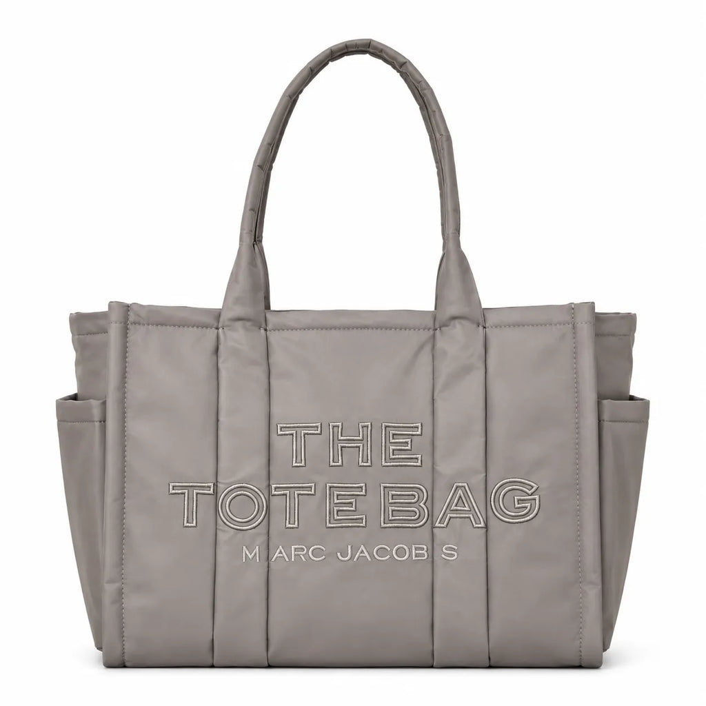 Marc Jacobs | Grey quilted nylon  embossed logo  double handles  exterior pocket  women's commuter tote bag