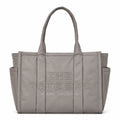 Marc Jacobs | Grey quilted nylon  embossed logo  double handles  exterior pocket  women's commuter tote bag